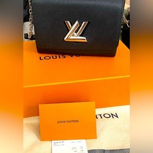 Authentic Luis Vuitton twist MM Handbag with dust bag, box and bag.